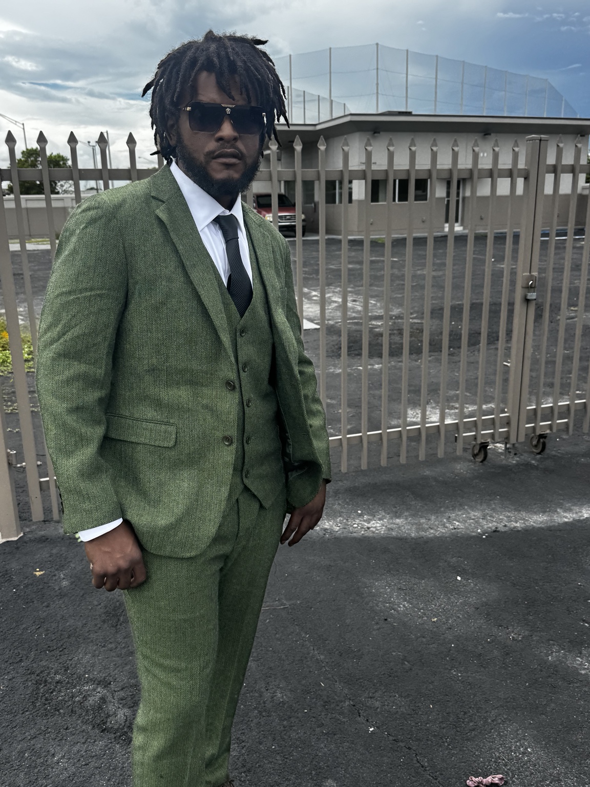 Portrait of the QE founder in front of the Miami Gardens flagship building